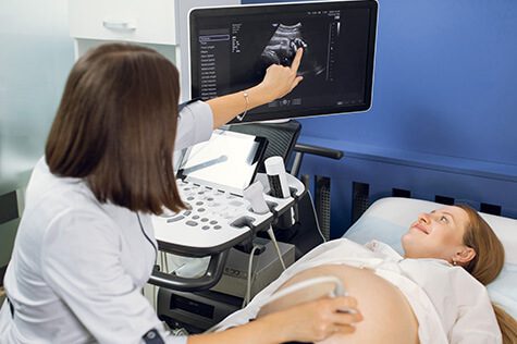 SMWC - pregnant woman getting ultrasound in a clinic